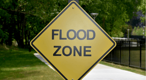 Yellow warning sign with "Flood Zone" writing.