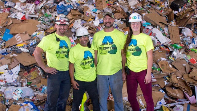 Outagamie workers pose in front of recycling