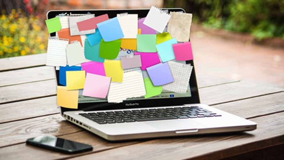 Post-it notes covering laptop screen