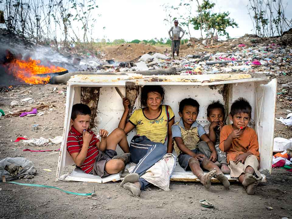 By Timothy Bouldry Photo of Kids at Dumpsite Fire