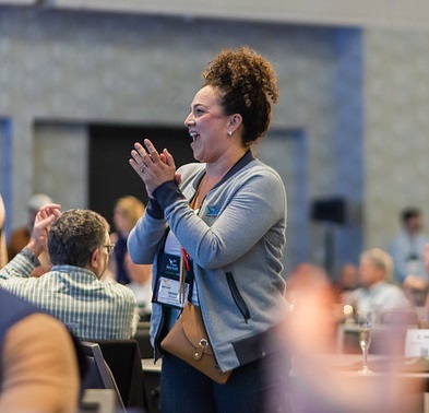 woman applauding at WASTECON