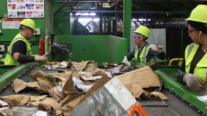 materials recovery workers sorting recycling