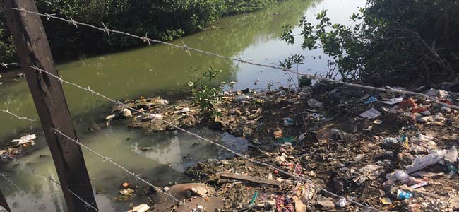 Uncontrolled waste affecting a Colombian stream